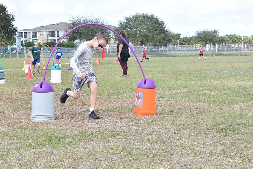 Second grader Patrick Danielcak goes through one of the obstacles during the walkathon.