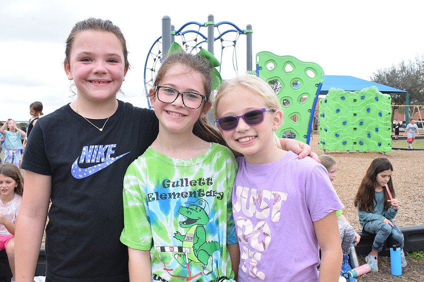 Third graders Harper Nixon, Ieese Donnelly and Charlotte Miller enjoy going through the different obstacles and playing with the bubbles.