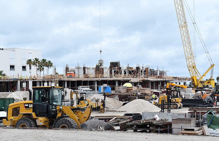 The base of the condominium building closest to GMD has been poured, with preparations under way to move to the second floor.