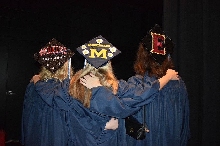 ODA graduates Madisyn Wandall, Samantha Malcolm and Celine DeAngelo show off their decorated caps.