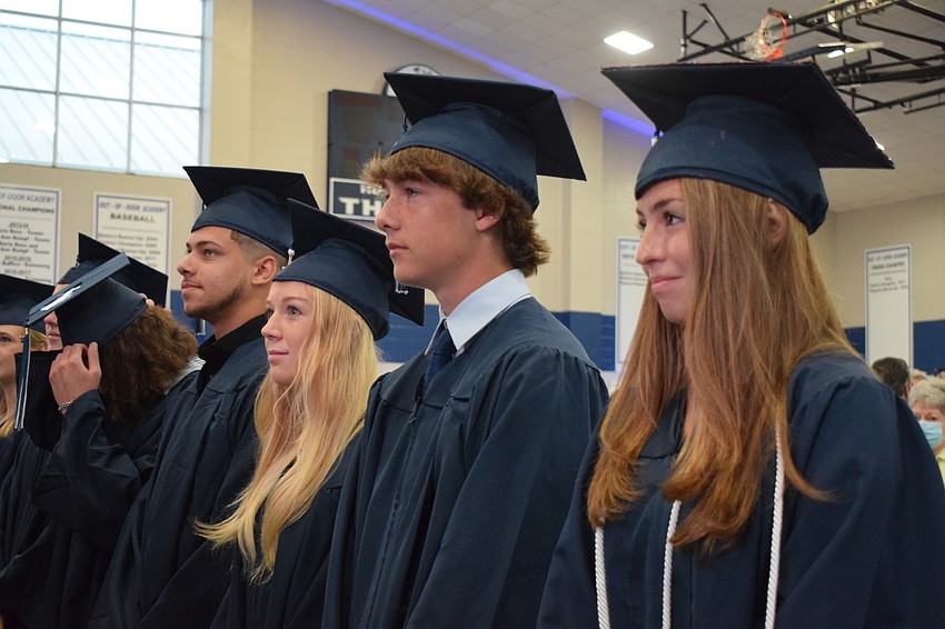 Hilton Hudson, Kaitlyn Hornung, William Harris and Cristina Harold wait to be seated as the rest of the senior class files into the Thunderdome.