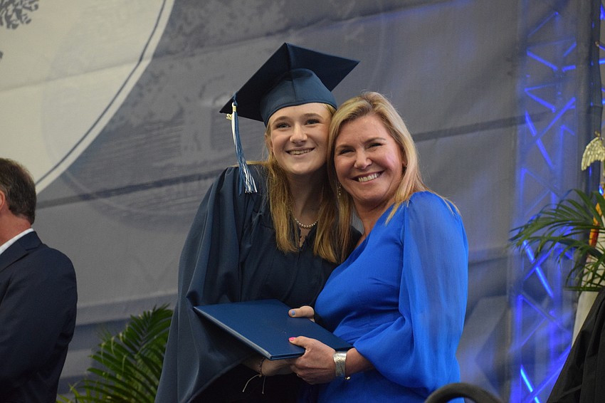 Claire Karp Hauser accepts her diploma from her aunt Tammy Karp, who is a member of ODA's board of trustees. 