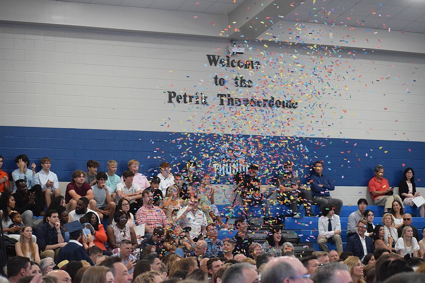 One family pops confetti to celebrate.