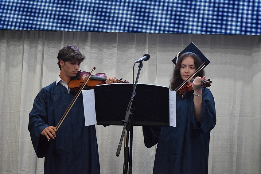 Aidan Marino and Celine DeAngelo perform in an ensemble at the end of the ceremony.