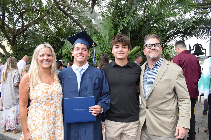 Carrie Lamb celebrates her son Ashton Lamb's graduation with her other son Alex Lamb and husband Rick Lamb. 