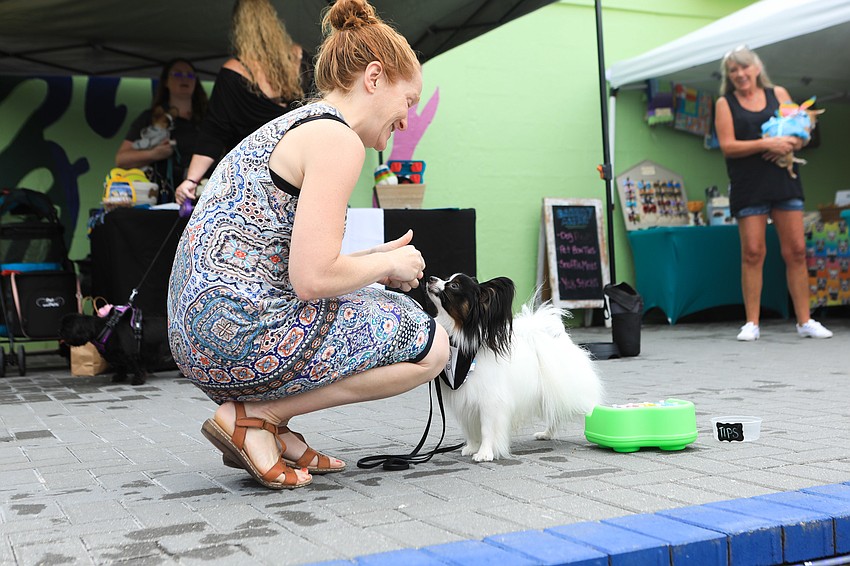 Jennifer Wells feeds Caspian for his music playing skills.