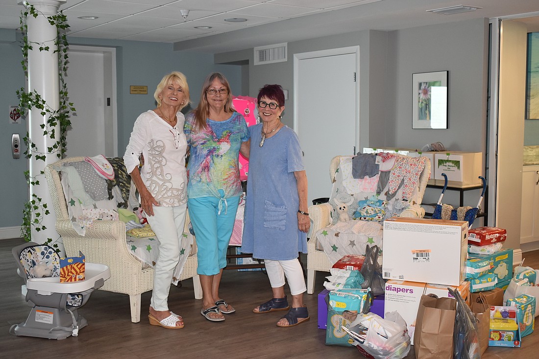 Joyce Welch, Diane Covino and Peggy Lammers with donations for Riverview&#39;s daycare program for teen parents seeking a high school diploma.