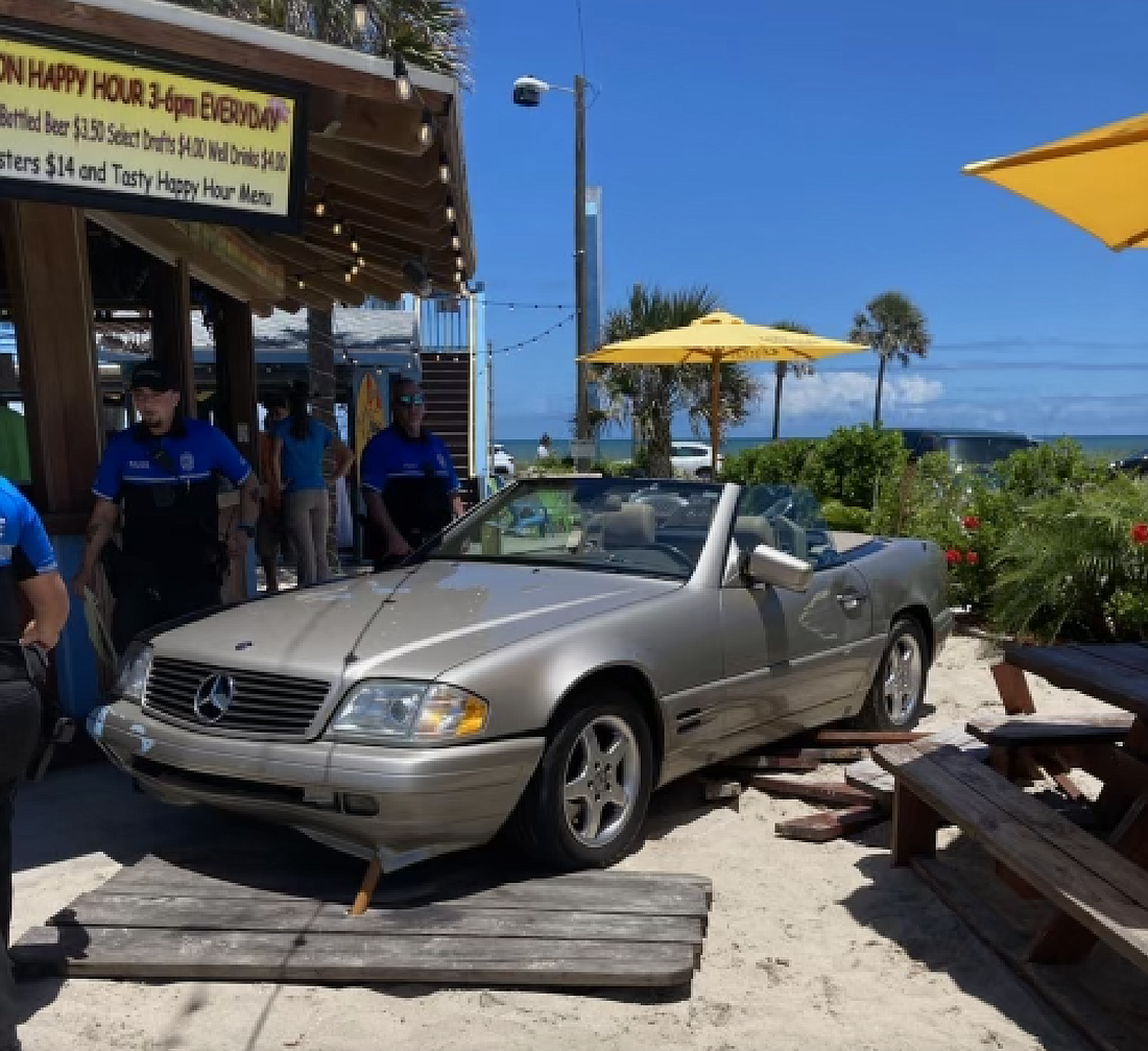 The car, a 1997 sedan, launched into the wooden fence and picnic table in Golden Lion's fenced-in eating area.Â Courtesy photo
