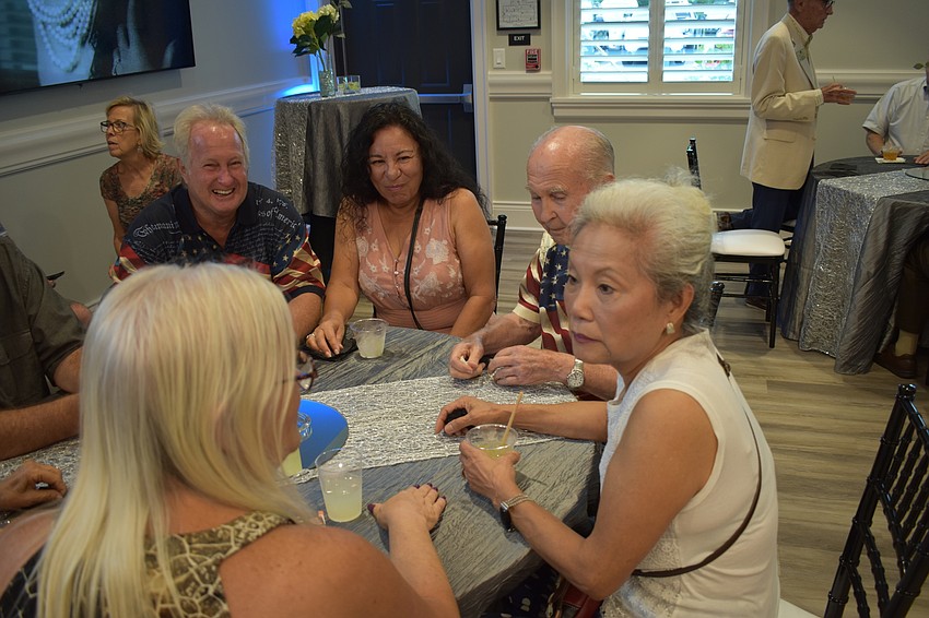In front, Sheryl Perkins, president of the Lakewood Ranch Gardening Club, meets David and Margie Brumbaugh, and Gene and Jackie Su Brumbaugh.