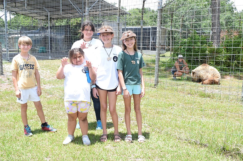 Matea Murariu, Emmy Dyer, Mia Dyer, Leighton Cracchiola and Sidney Lamarre spend time learning about every bear at Bearadise Ranch from owner Monica Welde.