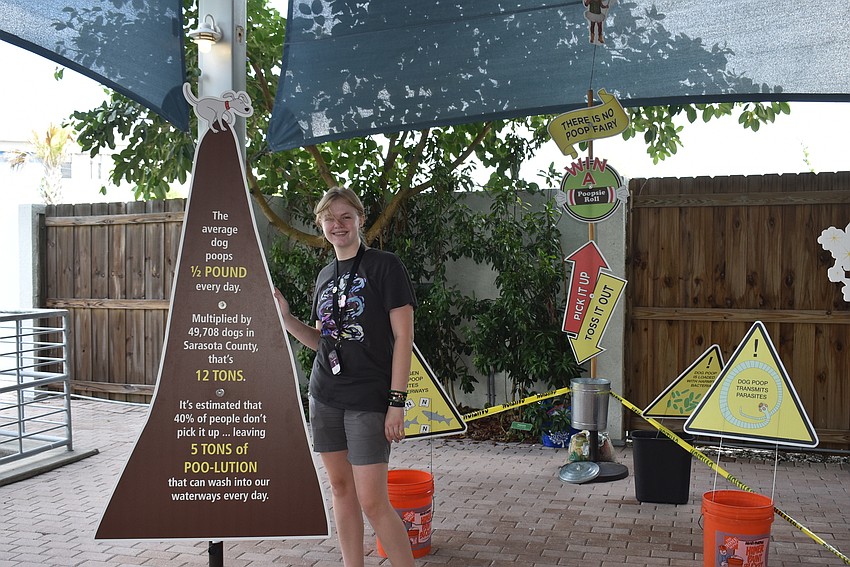 Tira Vandenhoek educates visitors on the impact of dog waste on our oceans.