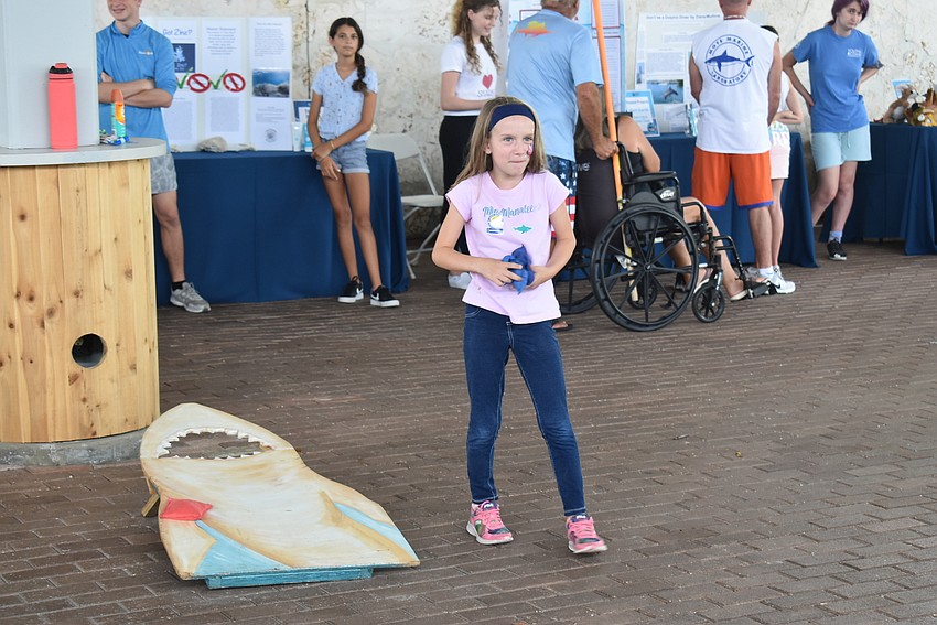 Charlotte Winemiller plays shark cornhole.