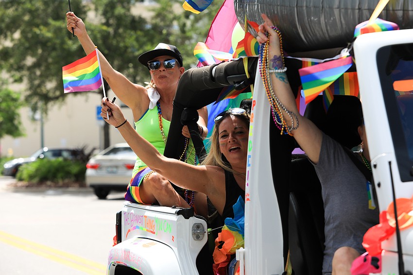 Vehicles went through Main Street to cheers.