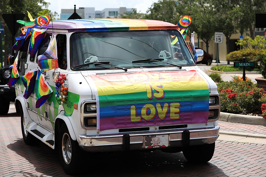 Vehicles went through Main Street to cheers.