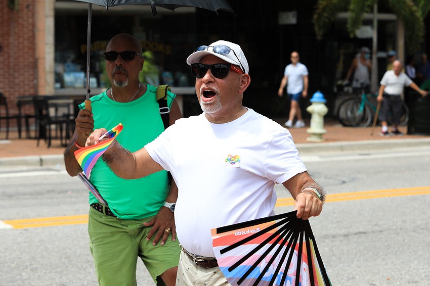 Alex Martinez cheers on the parade.