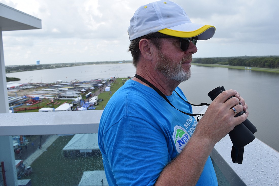 Sarasota&#39;s John Savage volunteers as the "Hawkeye," who keeps his eye on the rowers from the top of the finish tower to make sure they stay safe.
