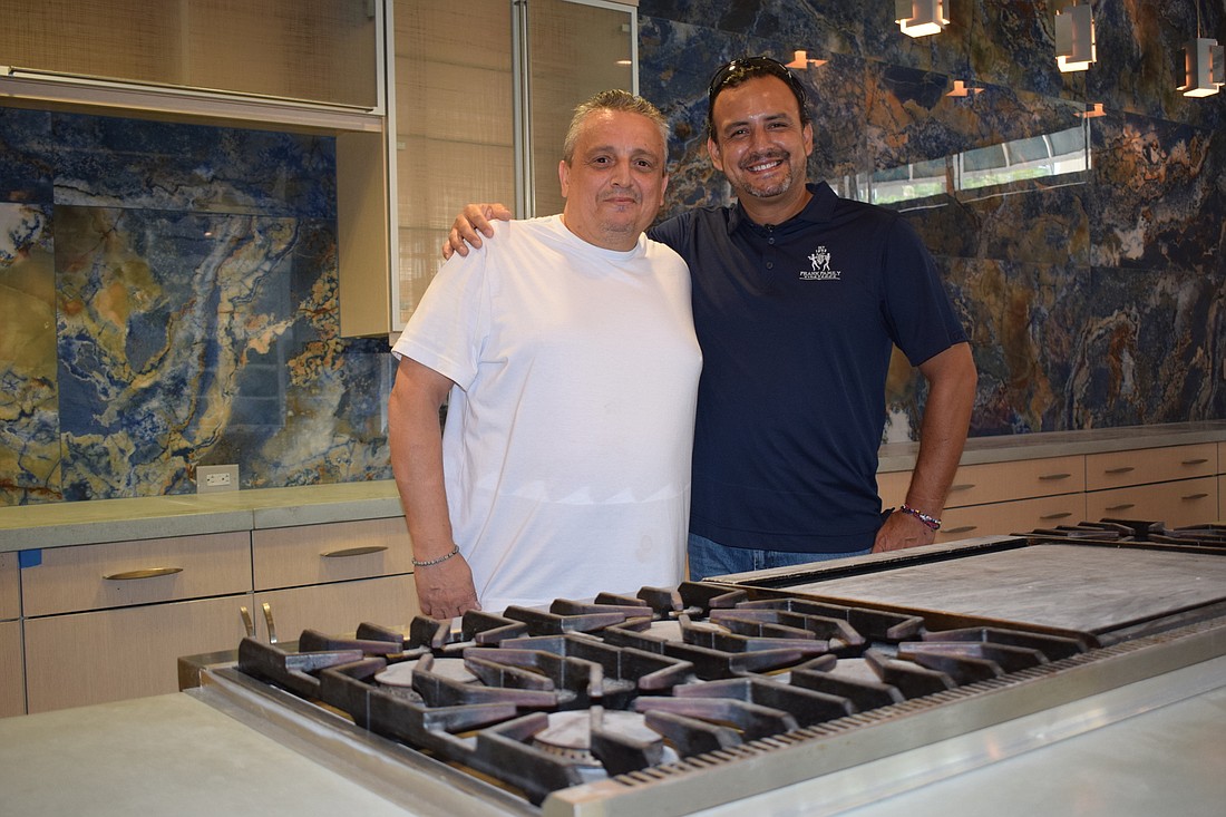 Angelo DiFiore poses with Sofia&#39;s Assistant Manager Jorge Zavalaga. The restaurant is expected to open the first week of August.
