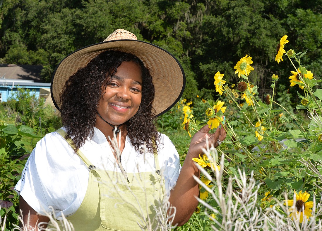 Photo by Dede Smith: Ashantae Green, the owner of Green Legacy Farm, is part of a 10-acre cooperative of five women that call themselves FarmHers.
