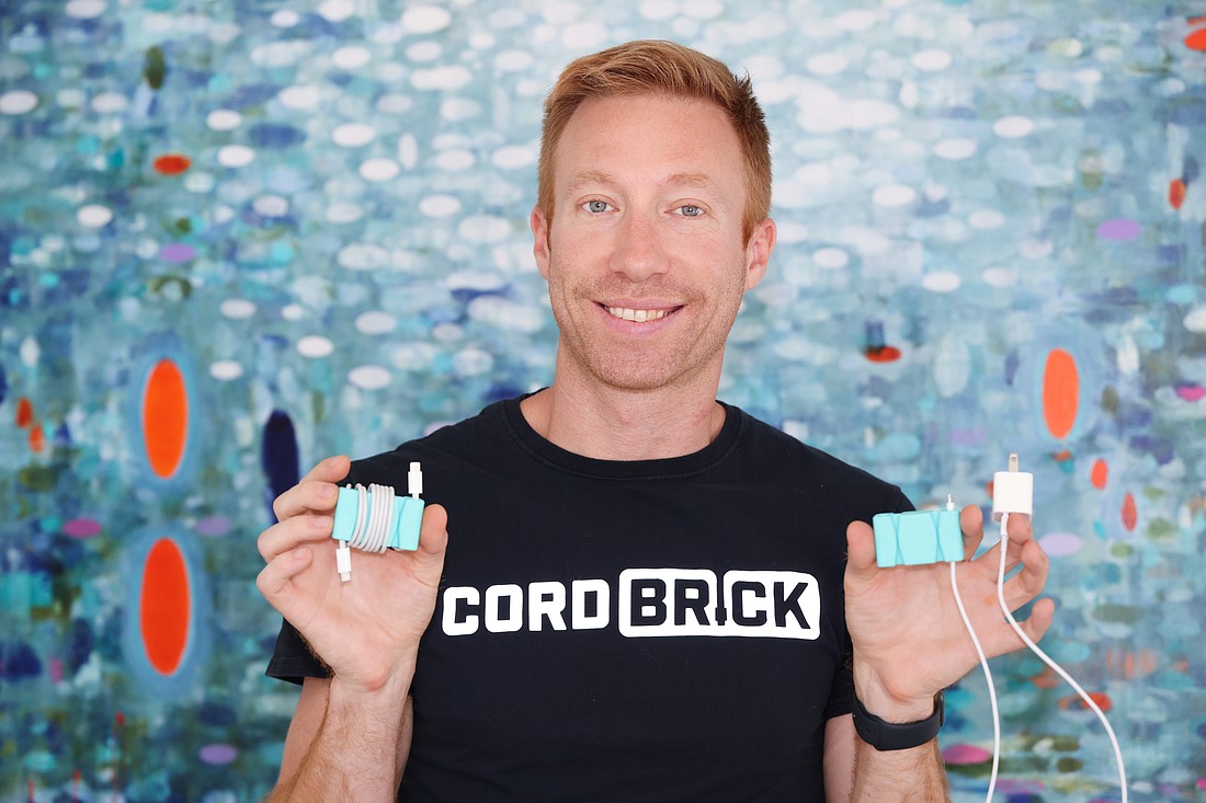 Nick Barrett created a solution for his phone cord entanglement issue, CordBrick. (Photo by Stefania Pifferi)