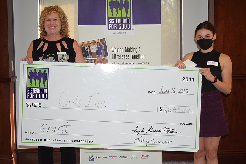 Sisterhood for Good's Deborah Breslof and Jazmin Giovino of Girls Inc. show off the grant.