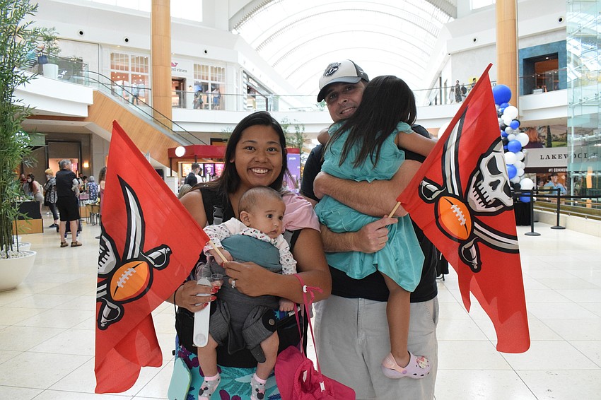 Lakewood Ranch's Tina Hart has fun with her 4-month-old daughter Paris Hart, husband Jerry Hart and 3-year-old Florence. The Hart family, who has season tickets for the Buccaneers, were excited to meet players from the team.