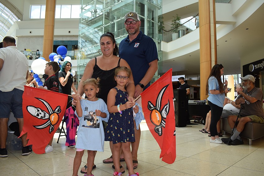 Sarasota 3-year-old Belen Bruns, her mother, Stephanie Bruns, 5-year-old sister Sofia Bruns and father Travis Bruns celebrate Father's Day at the mall.