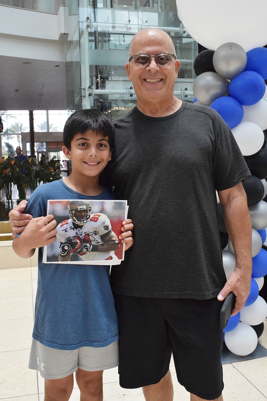 Sarasota's Ryan Dargham, who is 12, says his dad, Alex Dargham, is kind, caring and loving. The Darghams had fun at the UTC Father's Day event.