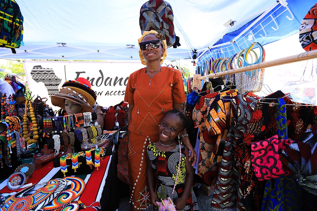 Gertrude and Endana Collymore sell plenty of clothing at the 2022 Newtown Juneteenth Block Party.