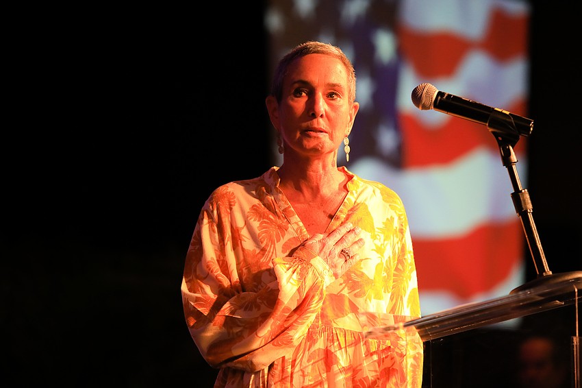 JFCS of the Suncoast CEO Nelle Miller leads the Pledge of Allegiance.