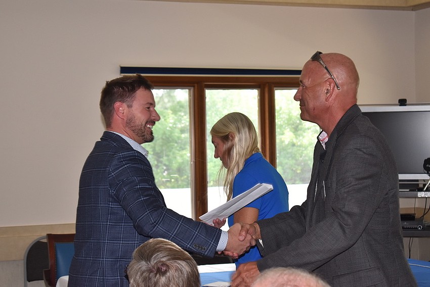 Bo Fuller congratulates Jeff Driver.