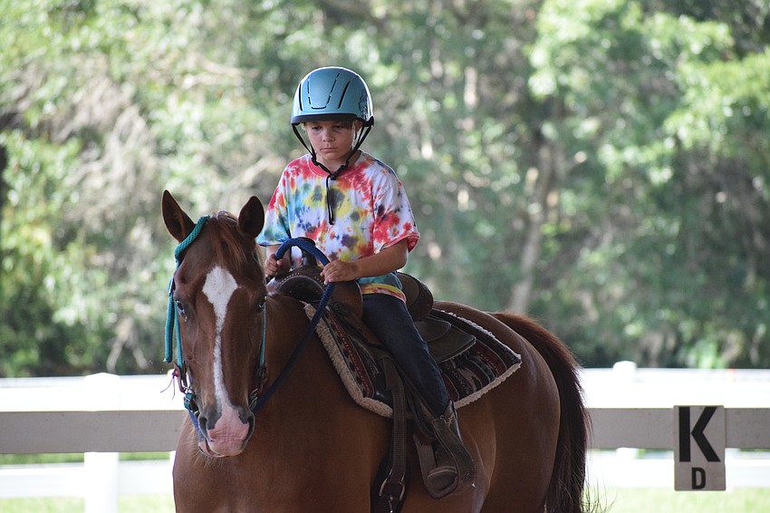 Lucius Rowell, who is 9, gets Cherokee moving.