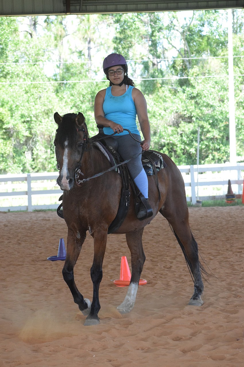 Sofia Hockin, who is 13 years old, has been riding at the Sarasota Manatee Association for Riding Therapy for a year and a half and loves making new friends during camp.