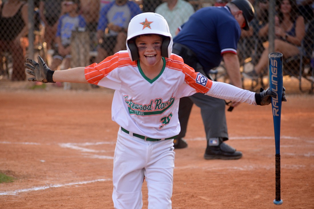 Ben Kloss celebrates following a solo home run in the Lakewood Ranch Little League 8-9-10 All-Star team&#39;s game against Buffalo Creek June 22. Lakewood Ranch defeated Buffalo Creek 13-3.