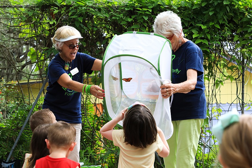 Ruth Frushour and Aura Rasmussen with the St. Clair Butterfly Foundation release a number of monarch butterflies into the sky.