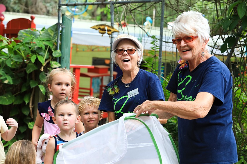 Ruth Frushour and Aura Rasmussen with the St. Clair Butterfly Foundation release a number of monarch butterflies into the sky.