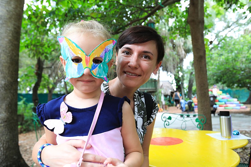 Anastasiya and Nika Sivakova enjoy the colored mask.