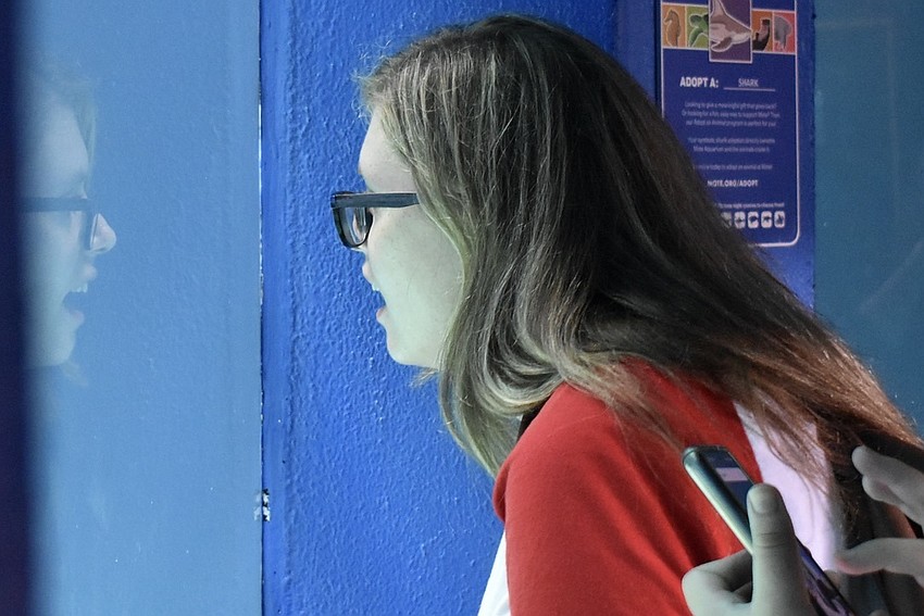 Erica McMurray watches Arty swim.