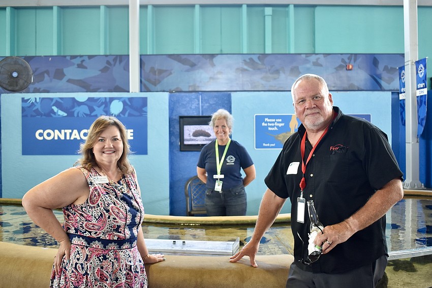 Morgan Gerhart and Tim Wirt with Mote volunteer Robin Hamilton