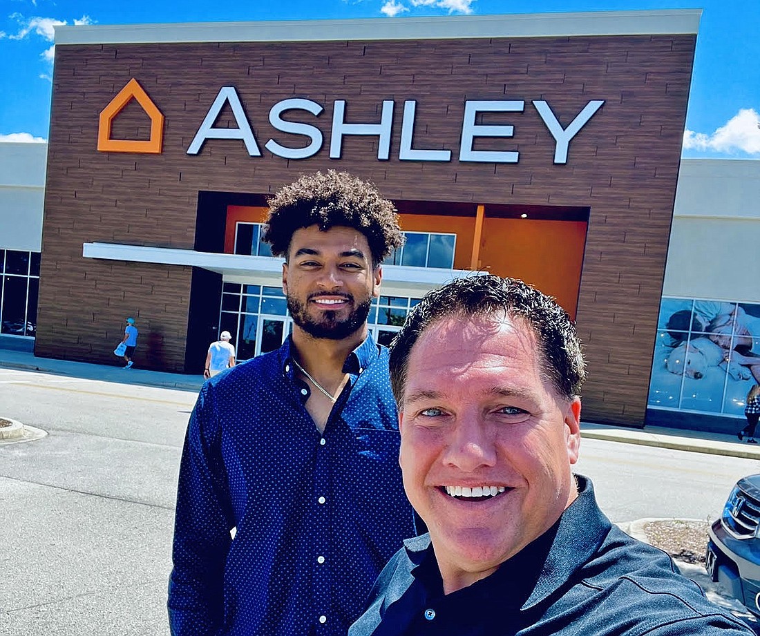 Former Ashley HomeStore owner Howard Fineman with his son, Tristan Fineman, who joined the company the past two years while earning his masterâ€™s degree from Florida State University at the same time.