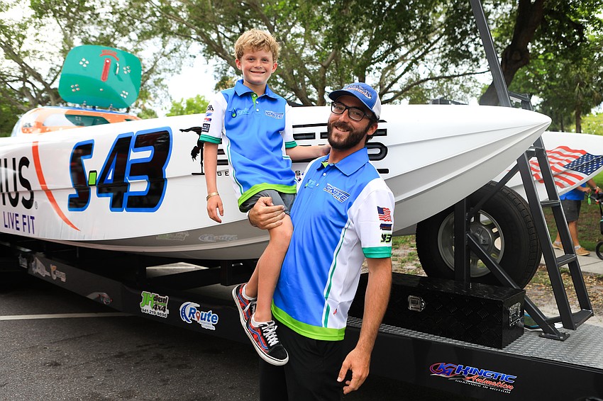 Connor Beckley and Luke Wagner take time to admire the boats on display.