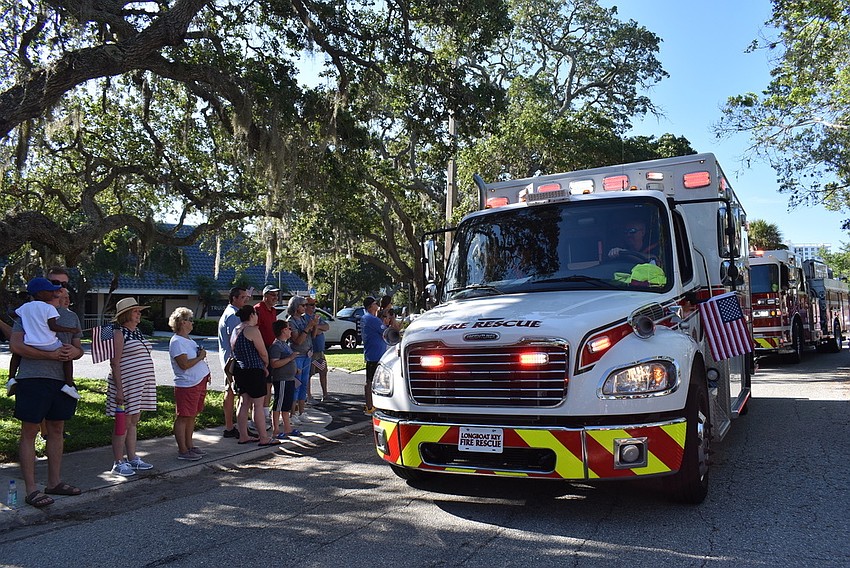 Emergency vehicles light up Bay Isles Road.