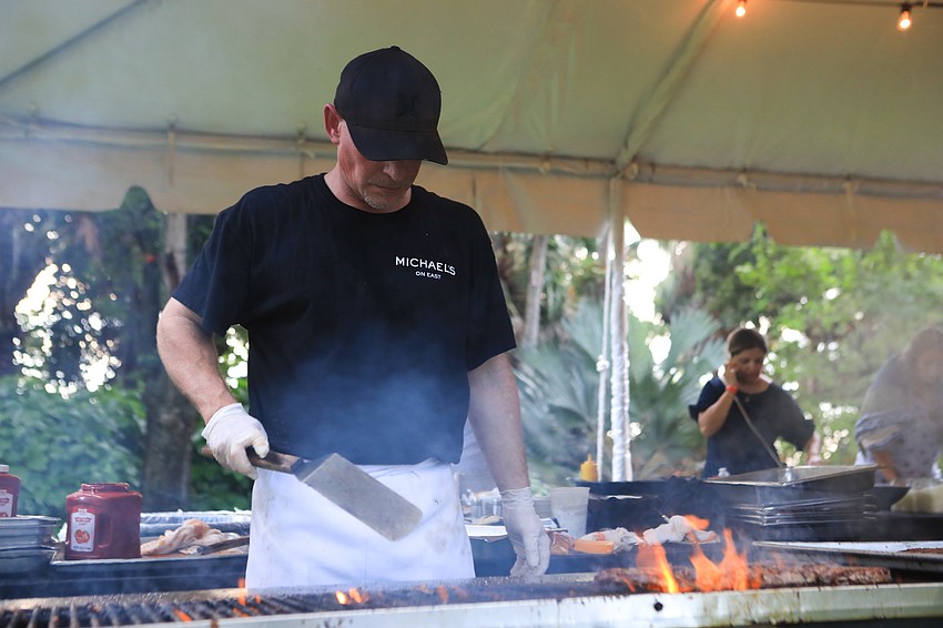 Chris McCrea serves up burgers.