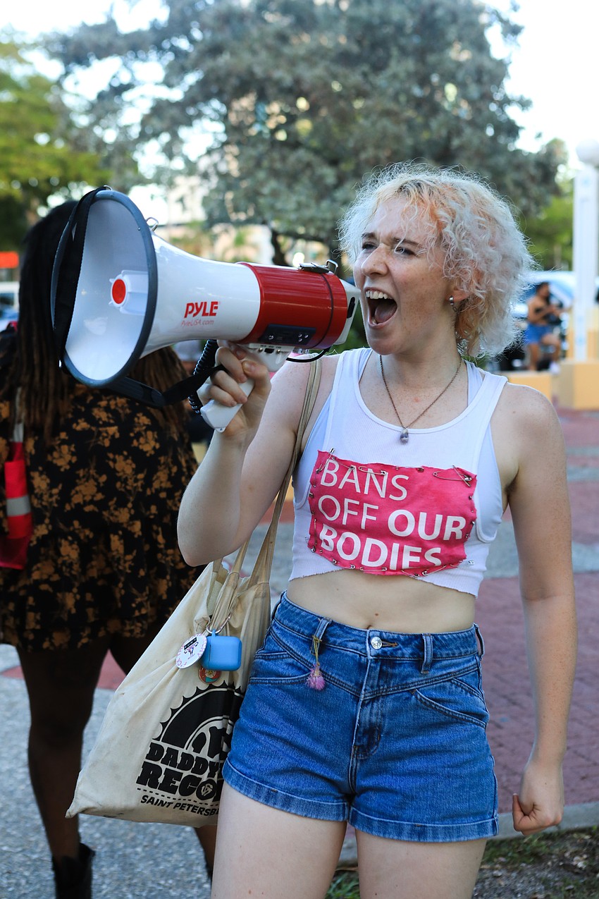Chloe Boggs leads the protest in chant.