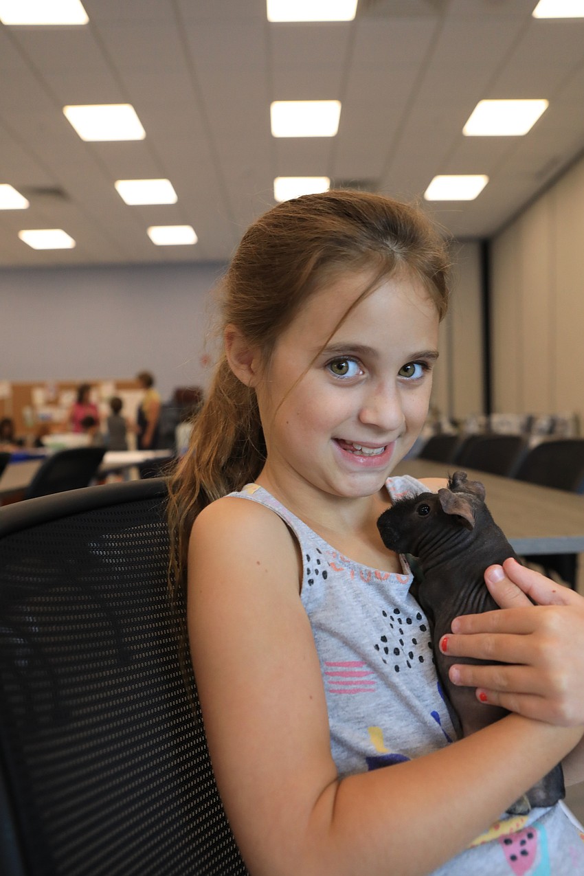 Sophia Christeas with Harold the skinny pig