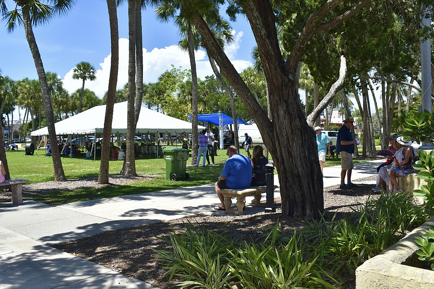 Sidewalk benches fill up for the first concert of the summer season.