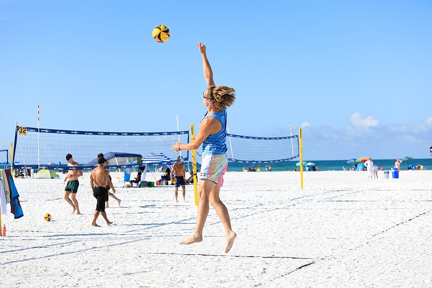 Men and women of various levels play early on Siesta Key.