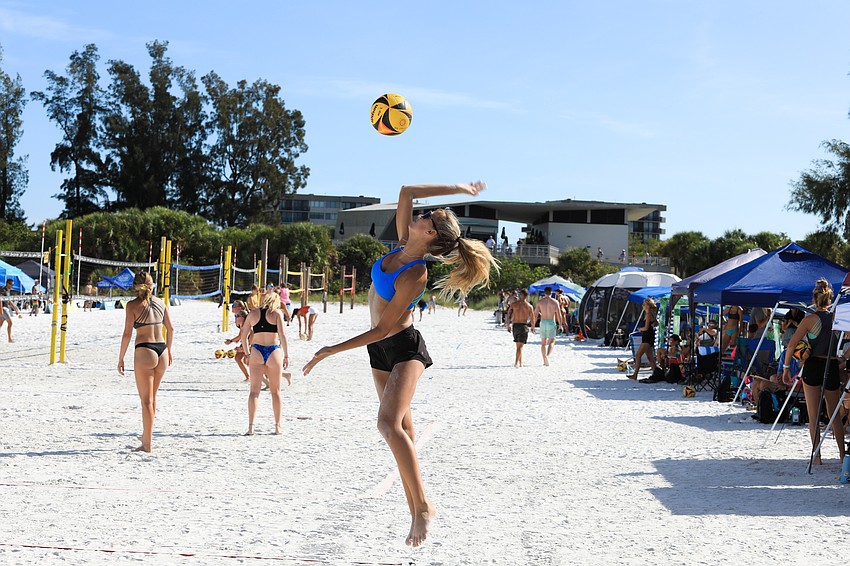 Men and women of various levels play early on Siesta Key.