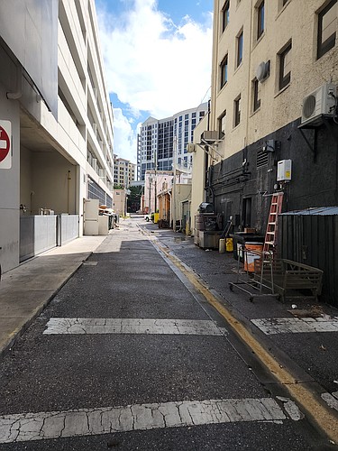 This alley behind buildings along Main Street between North Palm and North Pineapple avenues is a prime candidate for alley beautification, according to Sarasota Mayor Erik Arroyo. (Photo by Andrew Warfield)