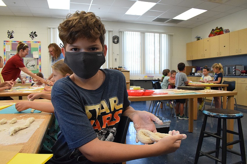Benjamin Rodriguez, who is 9, shows off his Philadelphia-inspired pretzel.