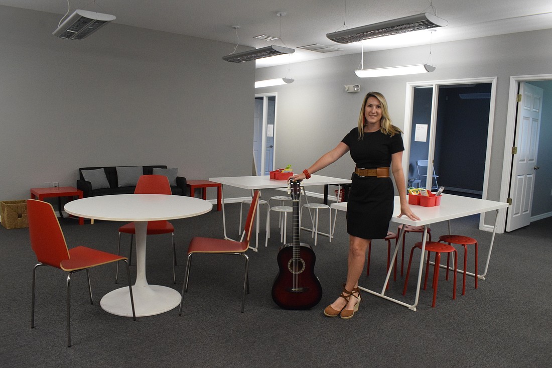 Jenny Townsend, the owner of Music Compound MAN, says the music lounge will be a place for students to relax before lessons as well as to perform. (Photo by Liz Ramos)